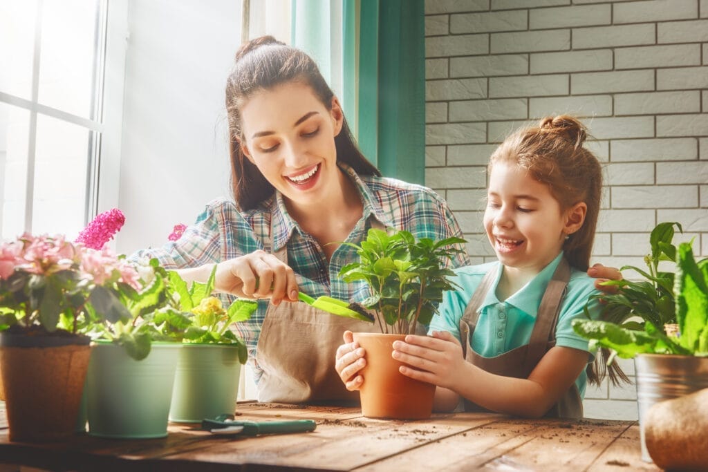 kids planting vegetables in pots